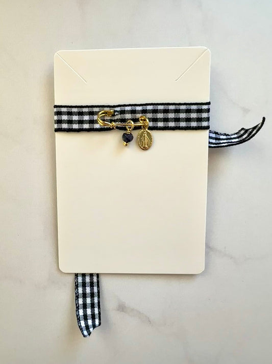 Prendedor protector bebé para ropa o cuna