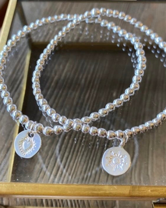 Pulsera mostacillas plateadas