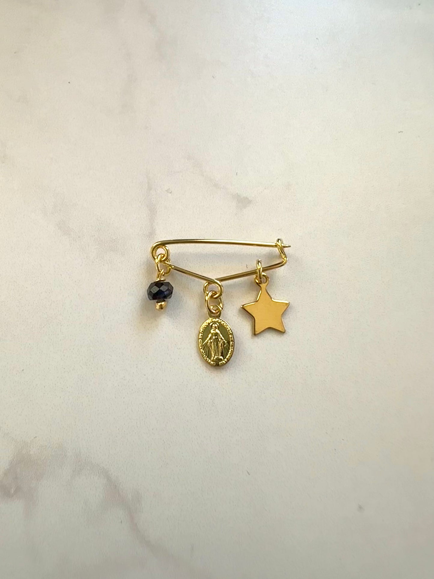 Prendedor protector bebé para ropa o cuna